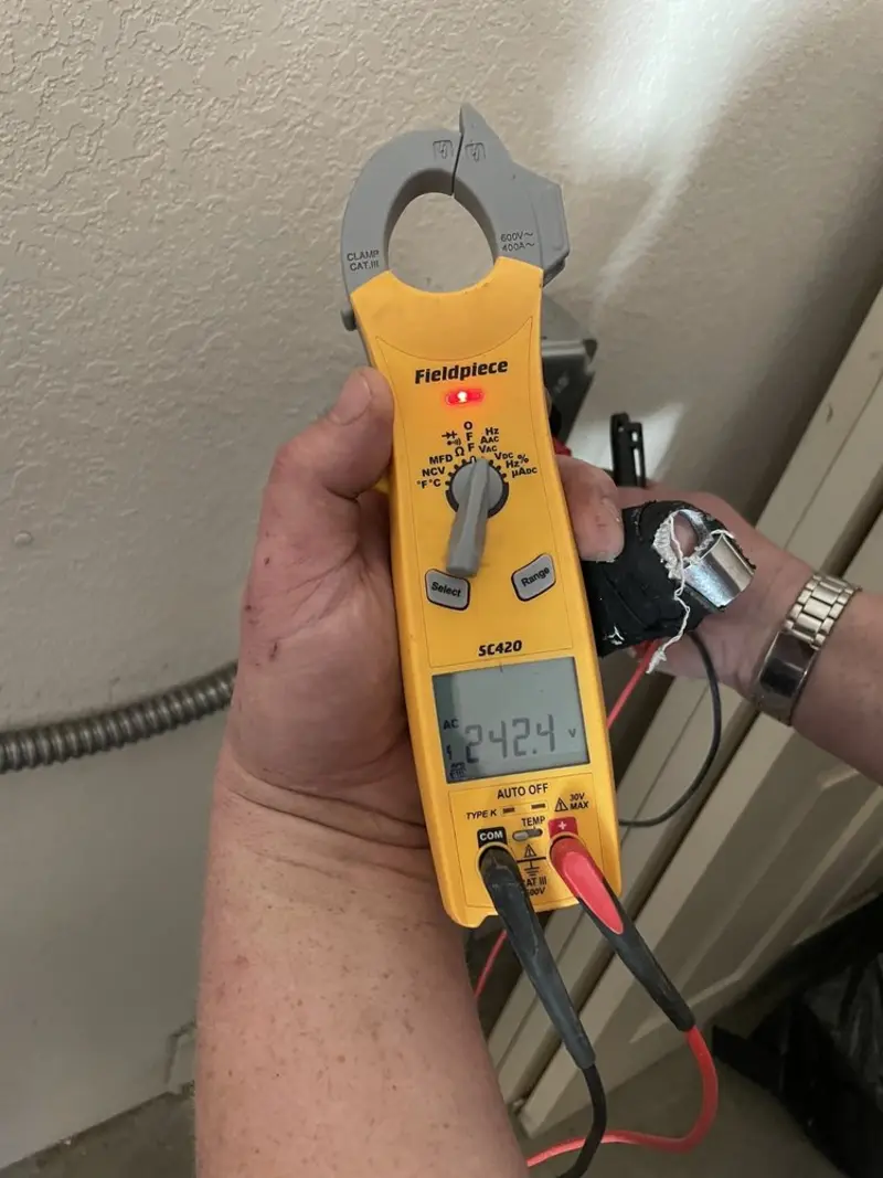 Voltage testing with clamp meter during Recessed Lighting Installation in Columbia